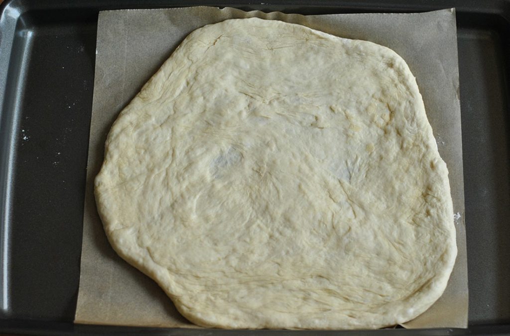 Rolled out homemade pizza dough