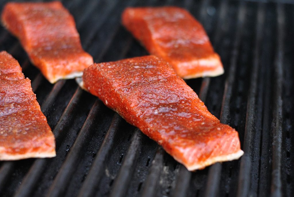 Salmon fillets being grilled