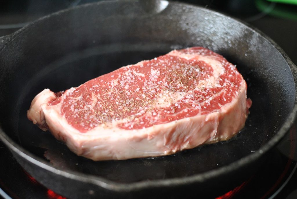 Searing steak in skillet
