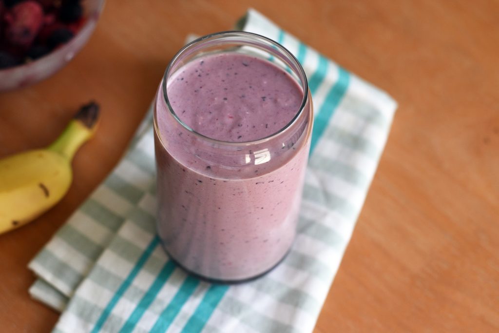 Healthy Breakfast Smoothie served in a jar with a banana next to it