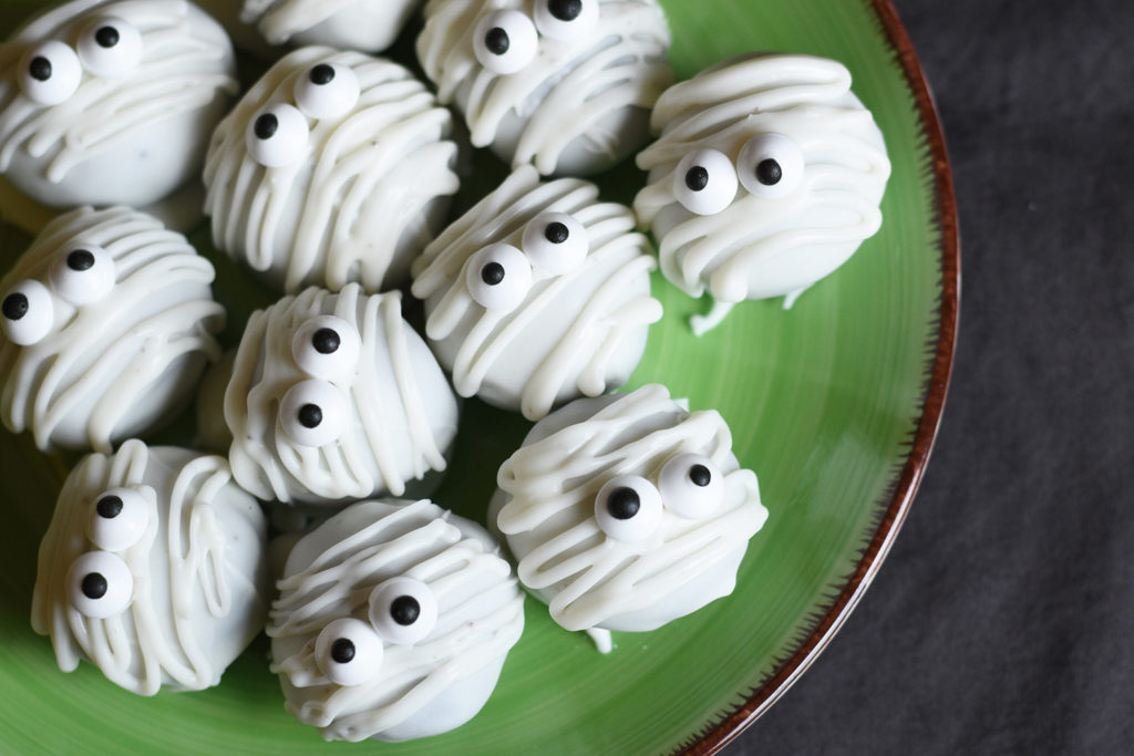 Spooky Mummy Oreo Balls served on a green plate