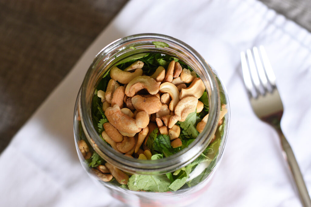 Garnish (nuts etc) on top of a mason jar salad