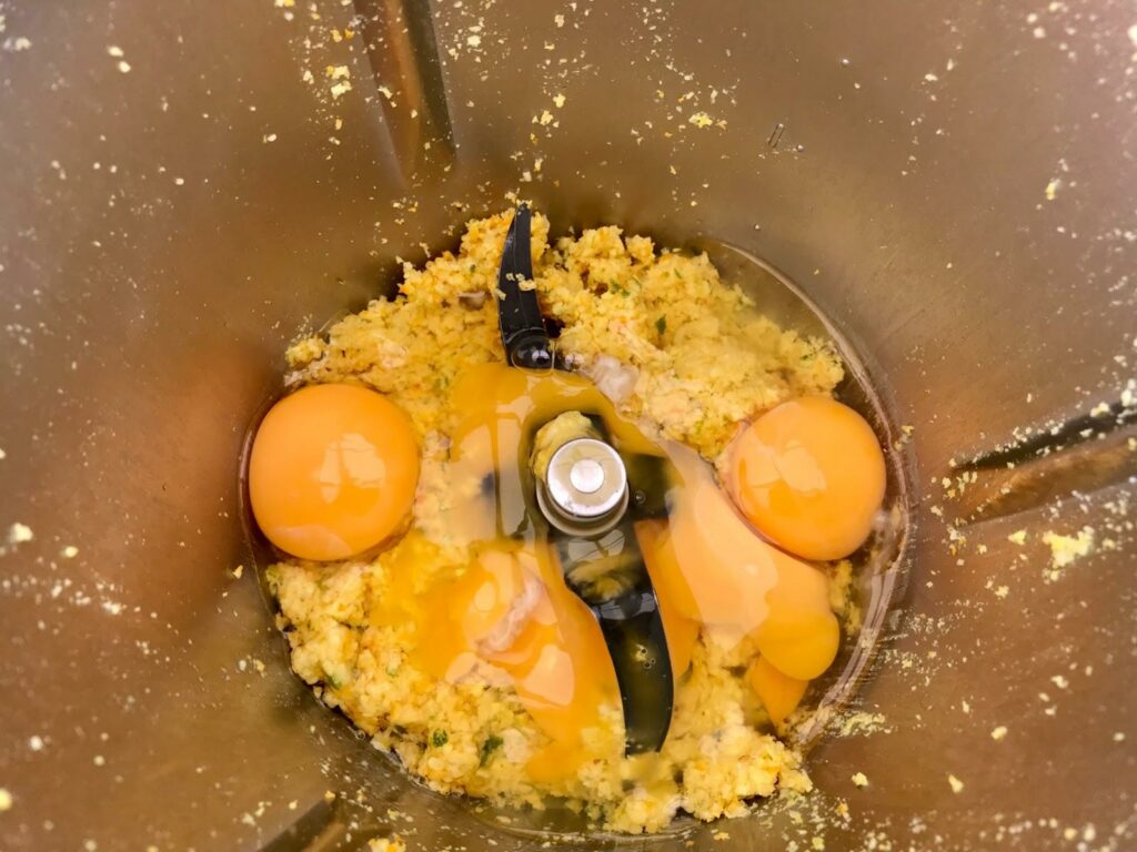 Adding eggs into the mixture