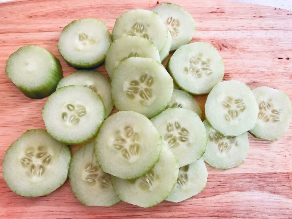 Sliced cucumber on the cutting board